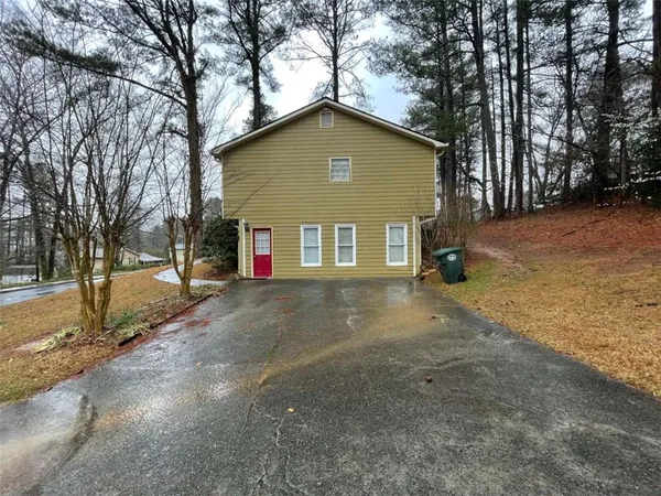 a view of a house with a yard and garage