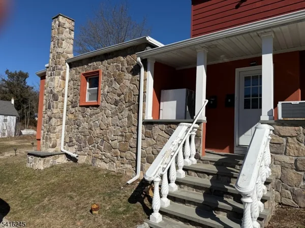 a view of a house with a large window