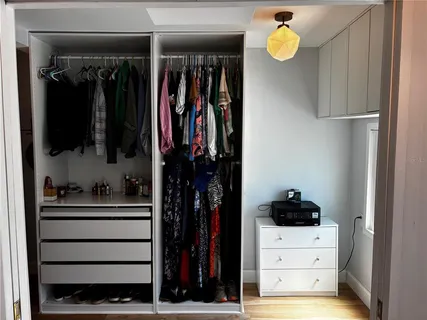 a bathroom with a sink a mirror and shower