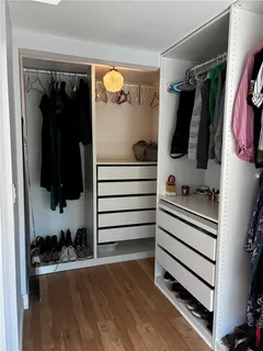 a white bath tub sitting next to a white sink