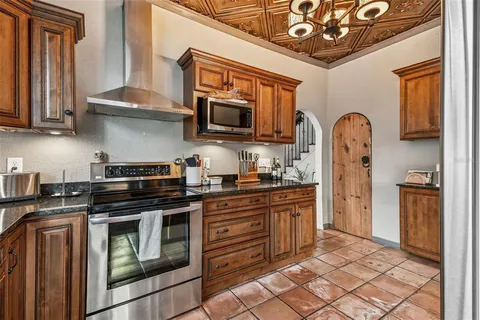 a bedroom with a bed and painting on the wall