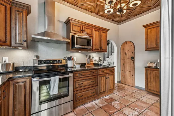 a bedroom with a bed and painting on the wall