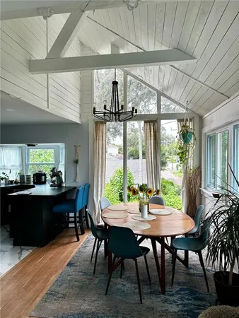 a view of a hallway with wooden floor and closet