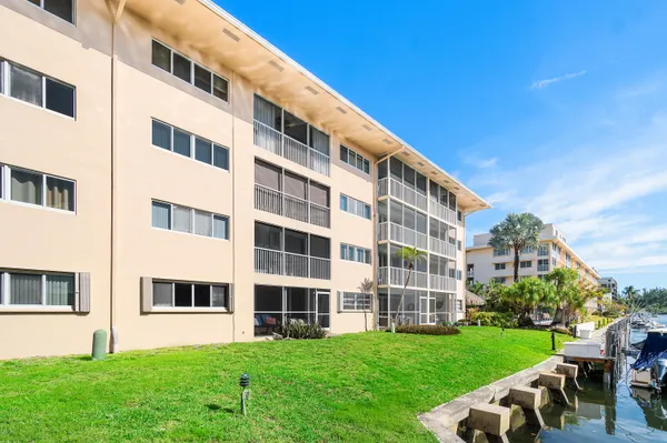a view of a building with a yard