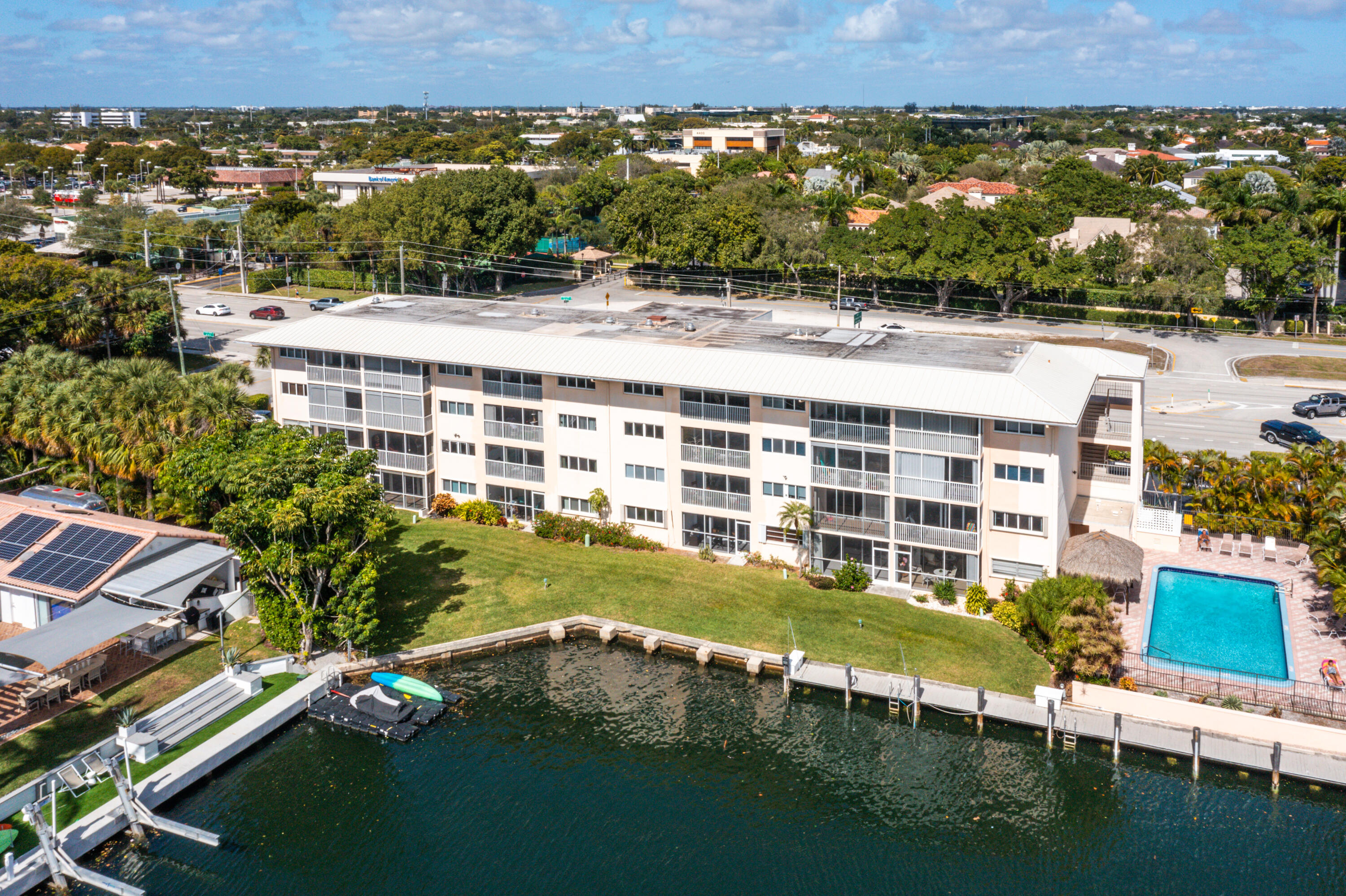 698 Northeast Spanish River Boulevard, Unit 140 Boca Raton, FL 33431 - Photo 16 of 21 an aerial view of a house with a yard