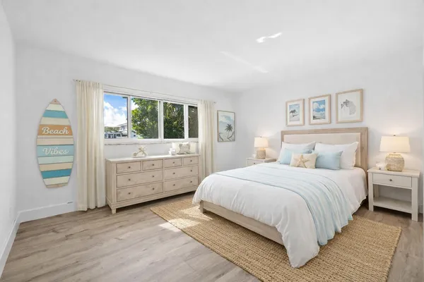 a bedroom with a bed and a dresser