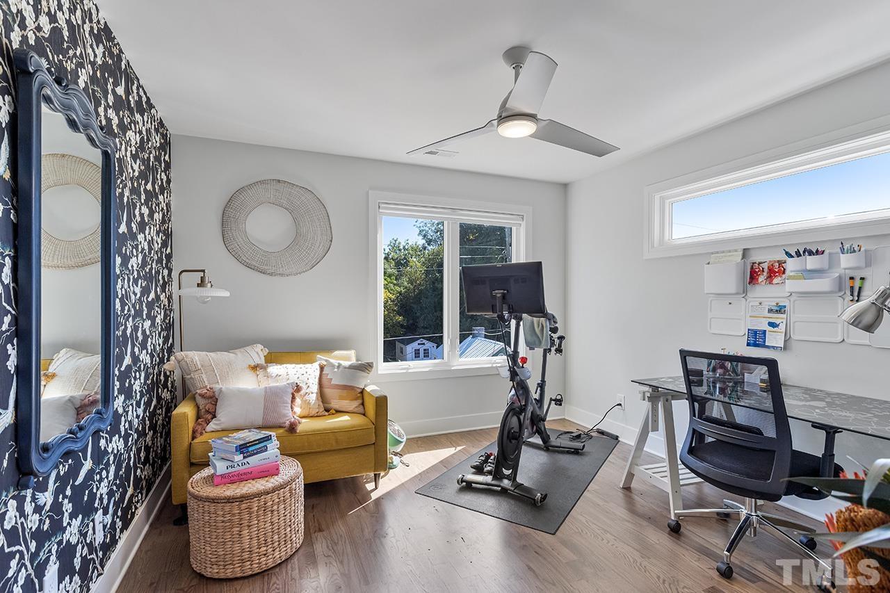 512 Alston Street Raleigh, NC 27601 - Photo 27 of 35 a room with gym equipment and a chandelier
