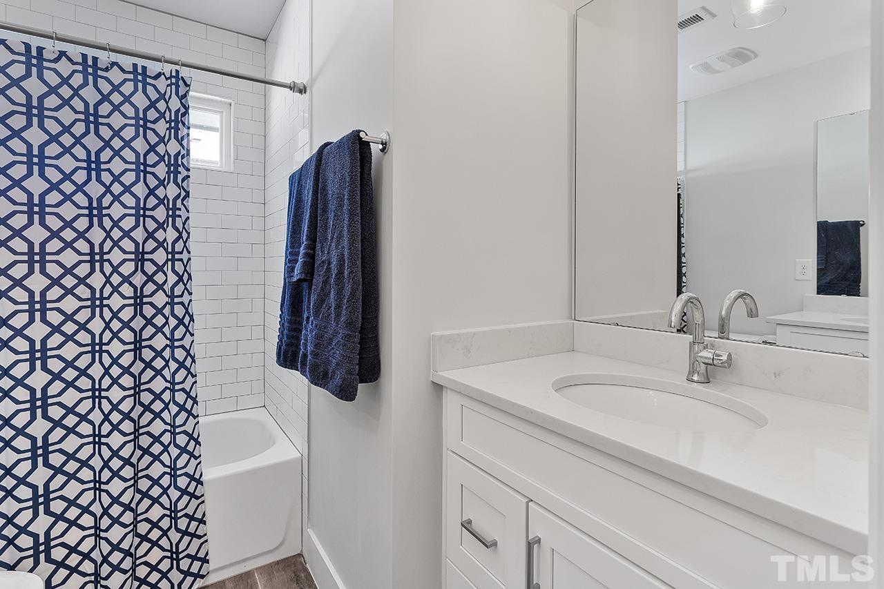 512 Alston Street Raleigh, NC 27601 - Photo 30 of 35 a bathroom with a sink and a mirror
