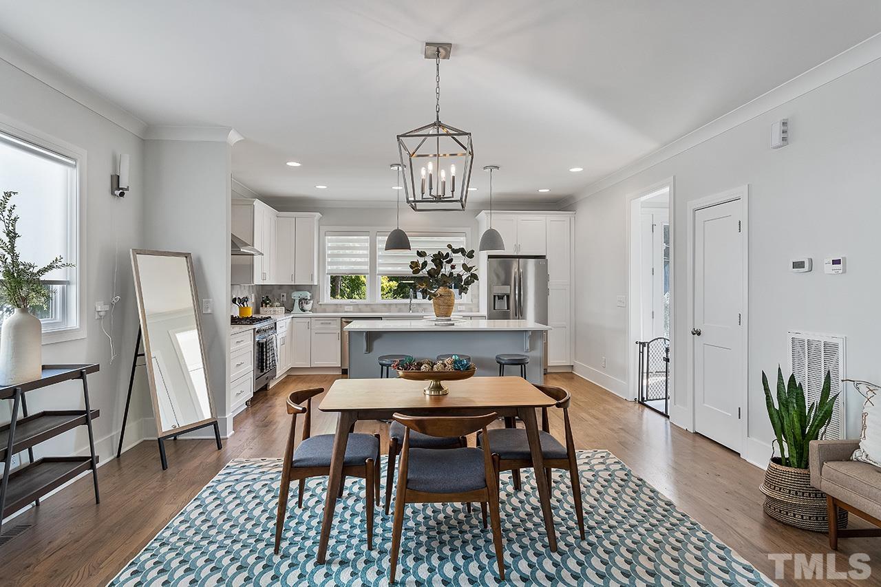 512 Alston Street Raleigh, NC 27601 - Photo 9 of 35 a dining room with furniture a chandelier and wooden floor