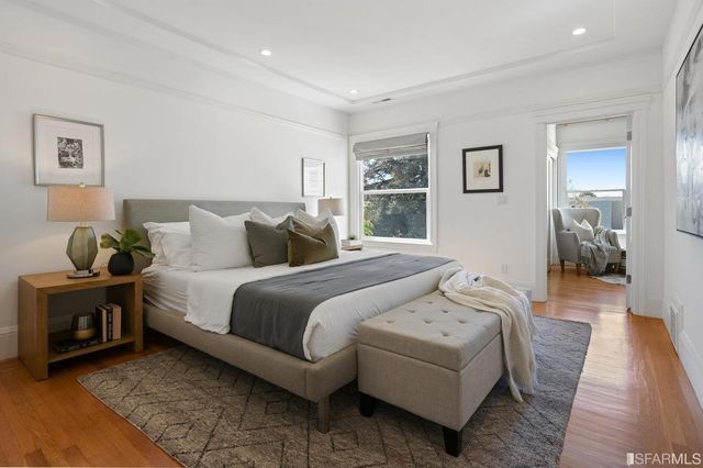 a bedroom with a bed and a couch