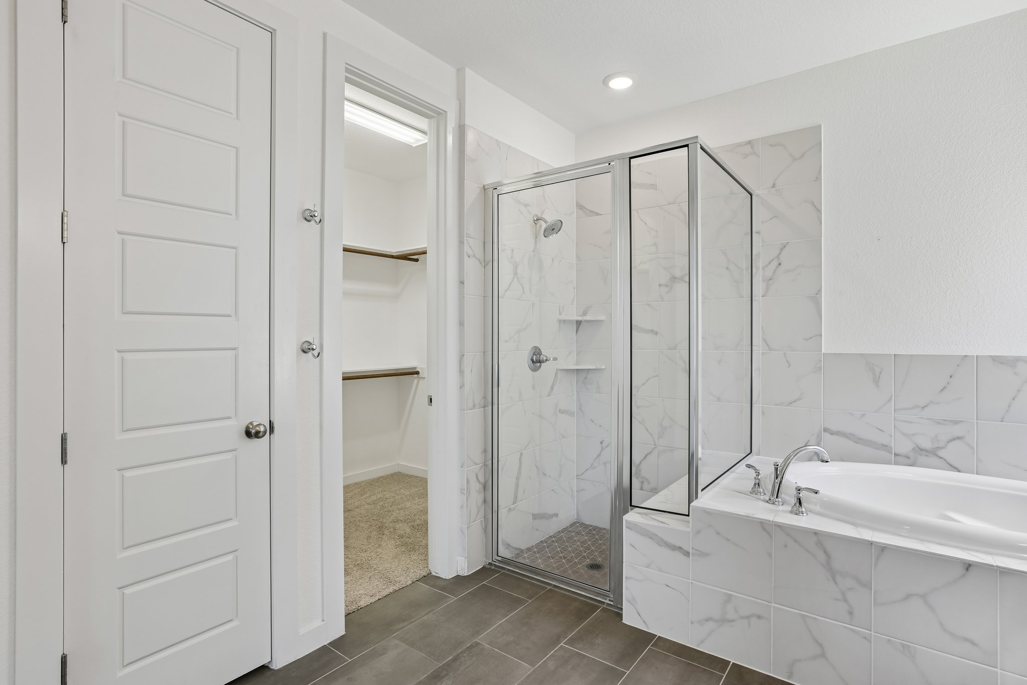 317 Independence Drive Kyle, TX 78640 - Photo 23 of 40 a bathroom with a bathtub and a shower