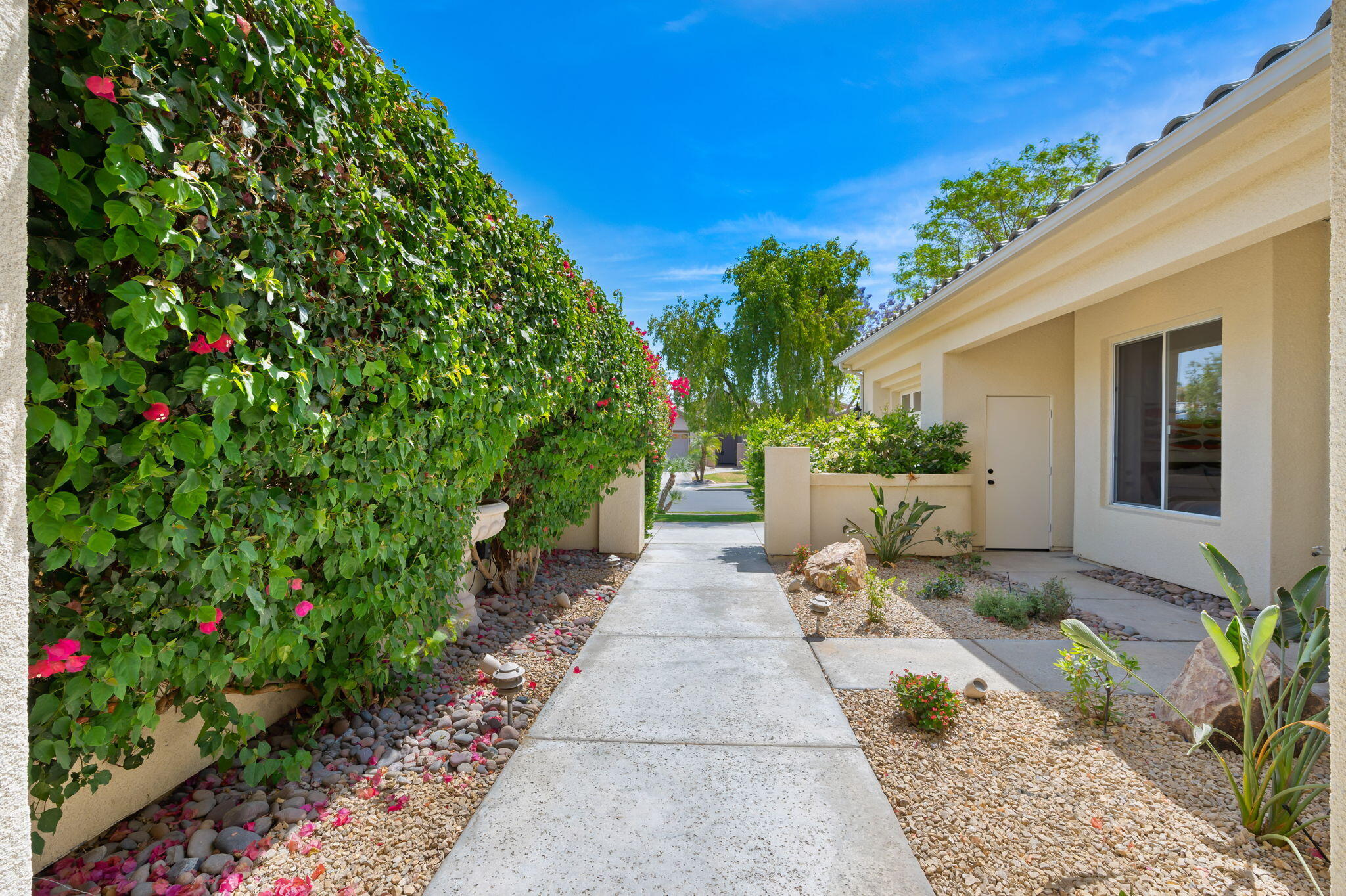 3 King Edward Court Rancho Mirage, CA 92270 - Photo 13 of 57 a view of a patio with table and chairs and potted plants