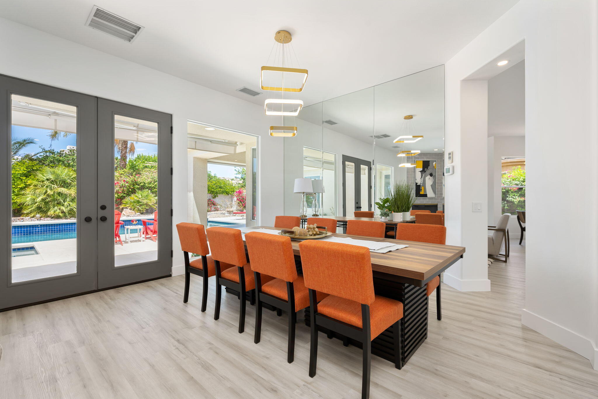 3 King Edward Court Rancho Mirage, CA 92270 - Photo 18 of 57 a view of a dining room with furniture and wooden floor