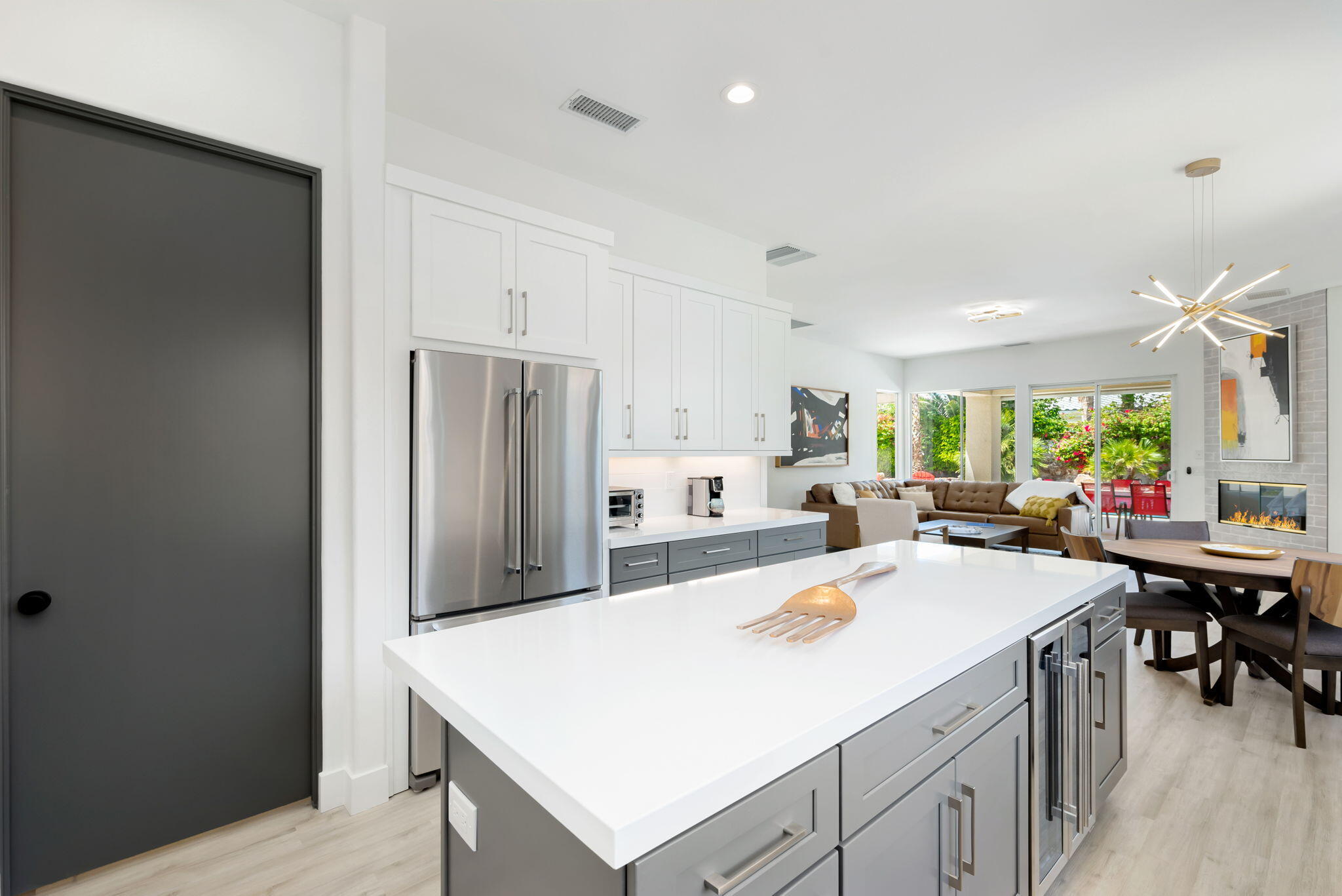 3 King Edward Court Rancho Mirage, CA 92270 - Photo 30 of 57 a kitchen with a sink a stove and refrigerator