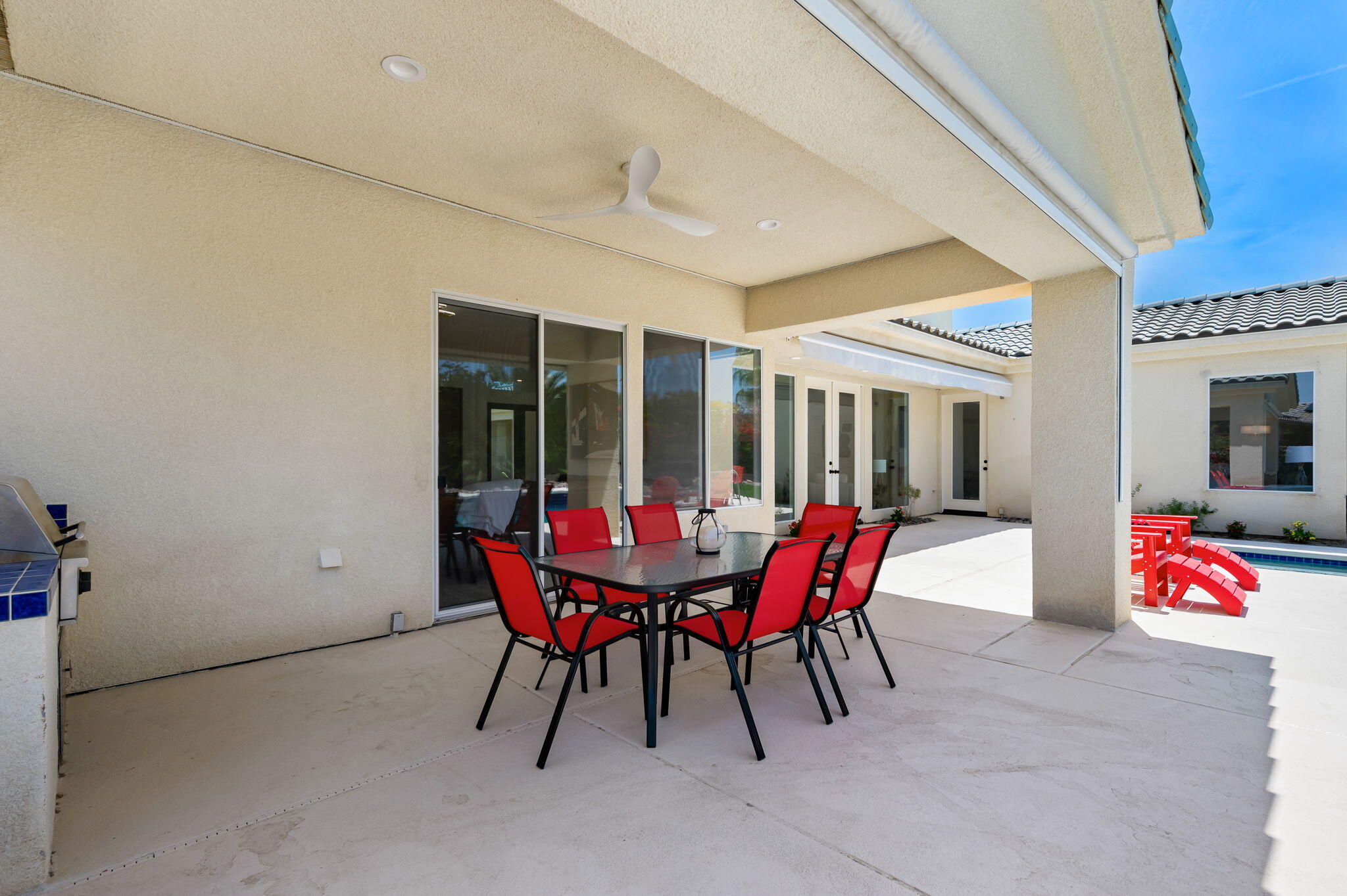 3 King Edward Court Rancho Mirage, CA 92270 - Photo 33 of 57 a patio with table and chairs and potted plants
