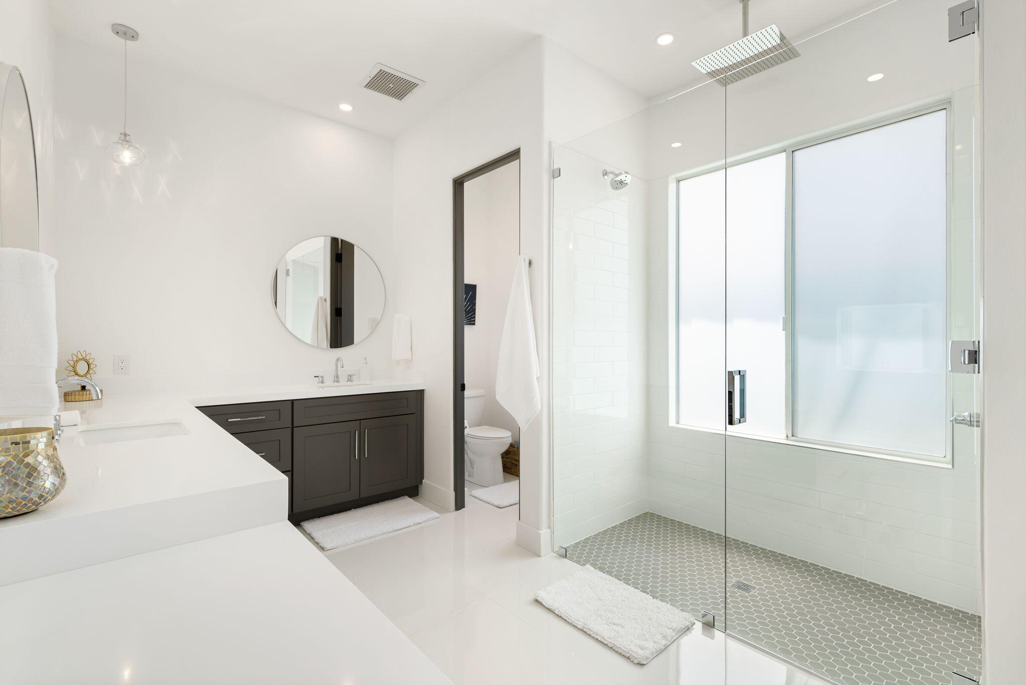 3 King Edward Court Rancho Mirage, CA 92270 - Photo 36 of 57 a spacious bathroom with a tub sink and mirror