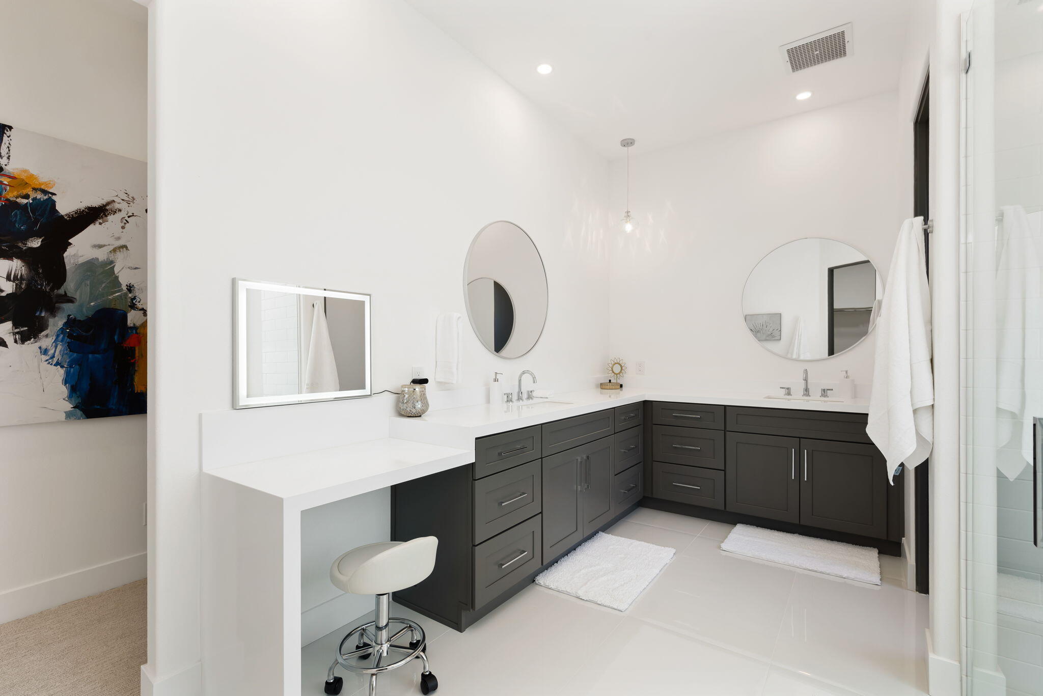 3 King Edward Court Rancho Mirage, CA 92270 - Photo 37 of 57 a spacious bathroom with a double vanity sink and mirror