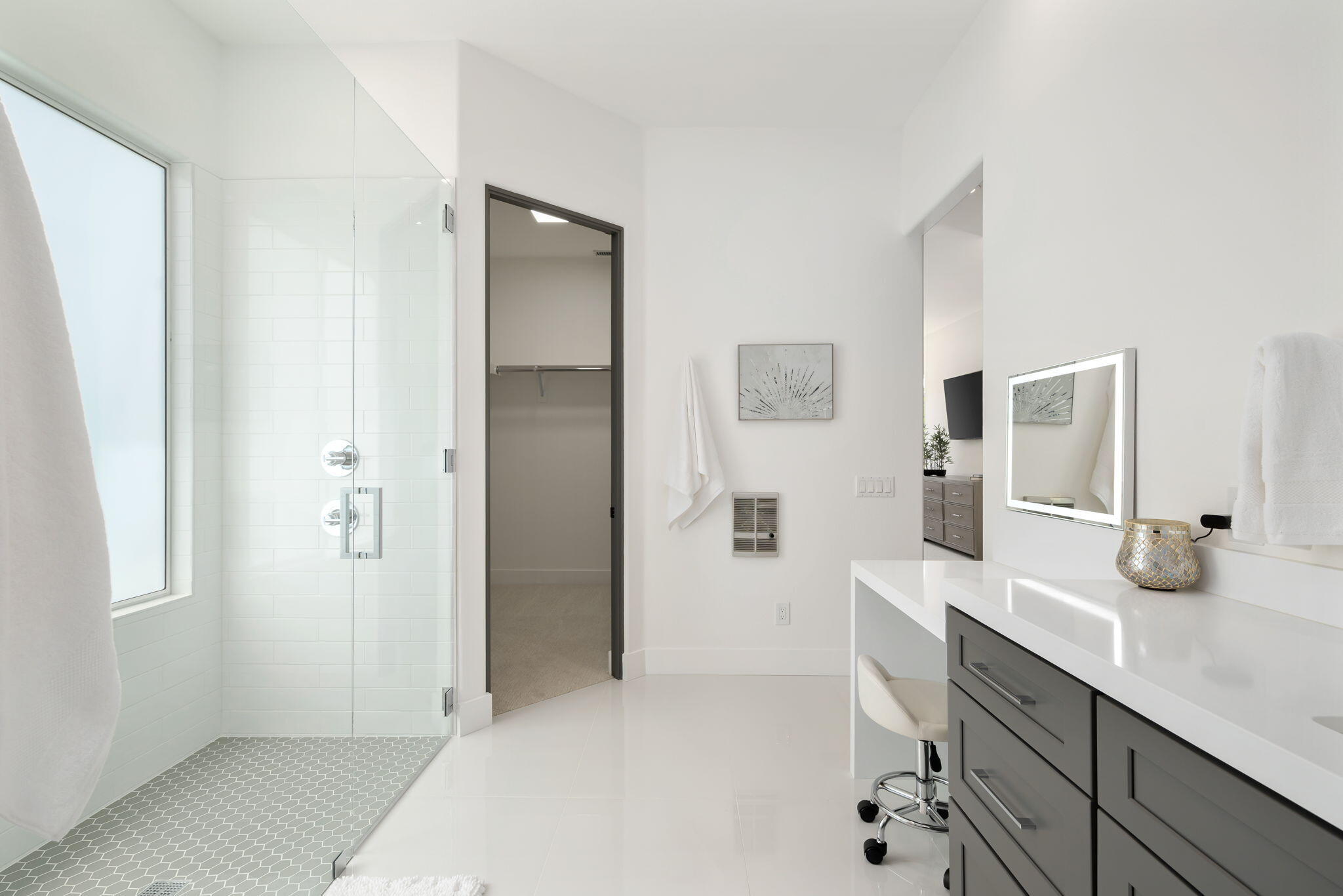 3 King Edward Court Rancho Mirage, CA 92270 - Photo 38 of 57 a spacious bathroom with a double vanity sink a mirror and shower