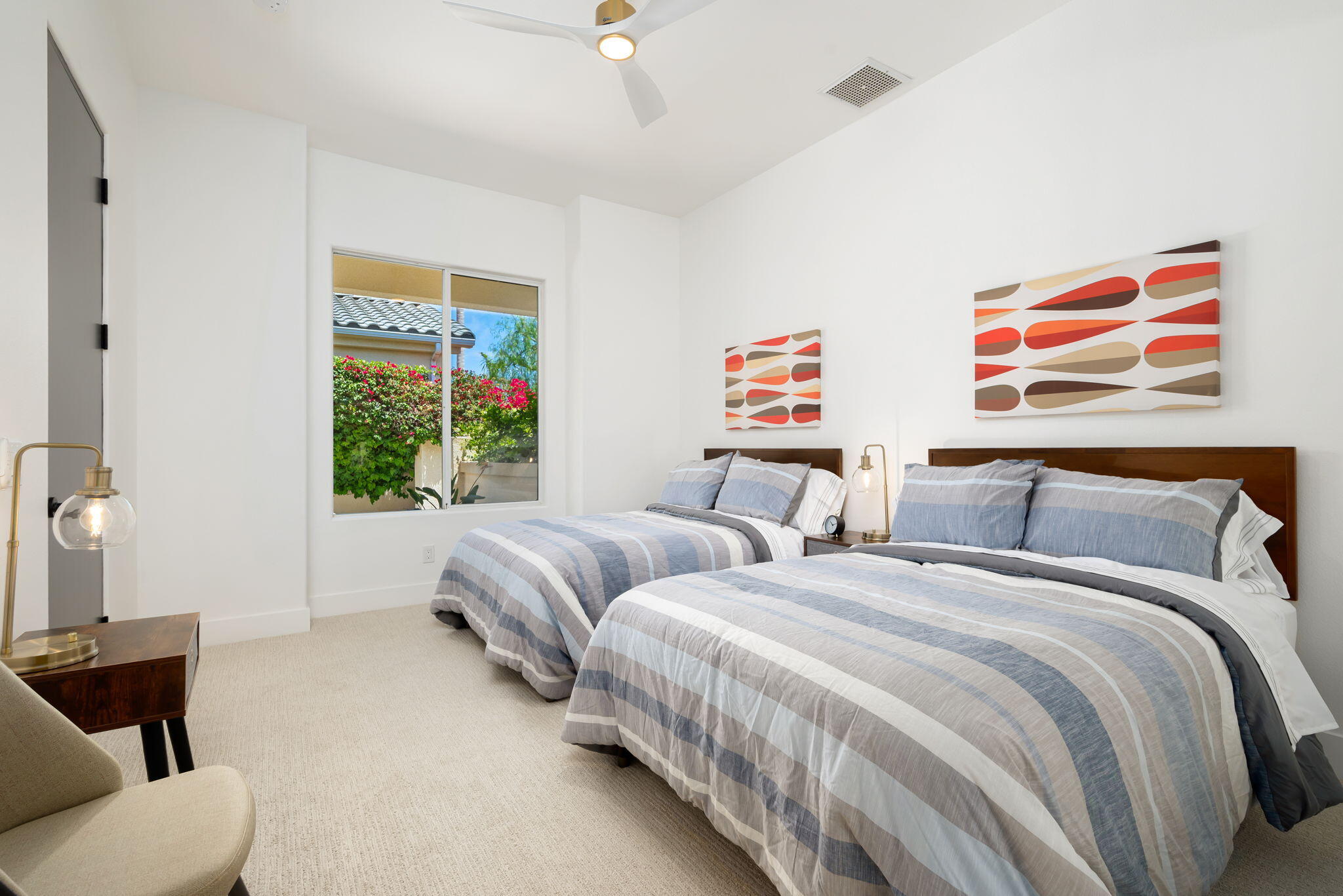 3 King Edward Court Rancho Mirage, CA 92270 - Photo 46 of 57 a bedroom with two beds and a painting on the wall