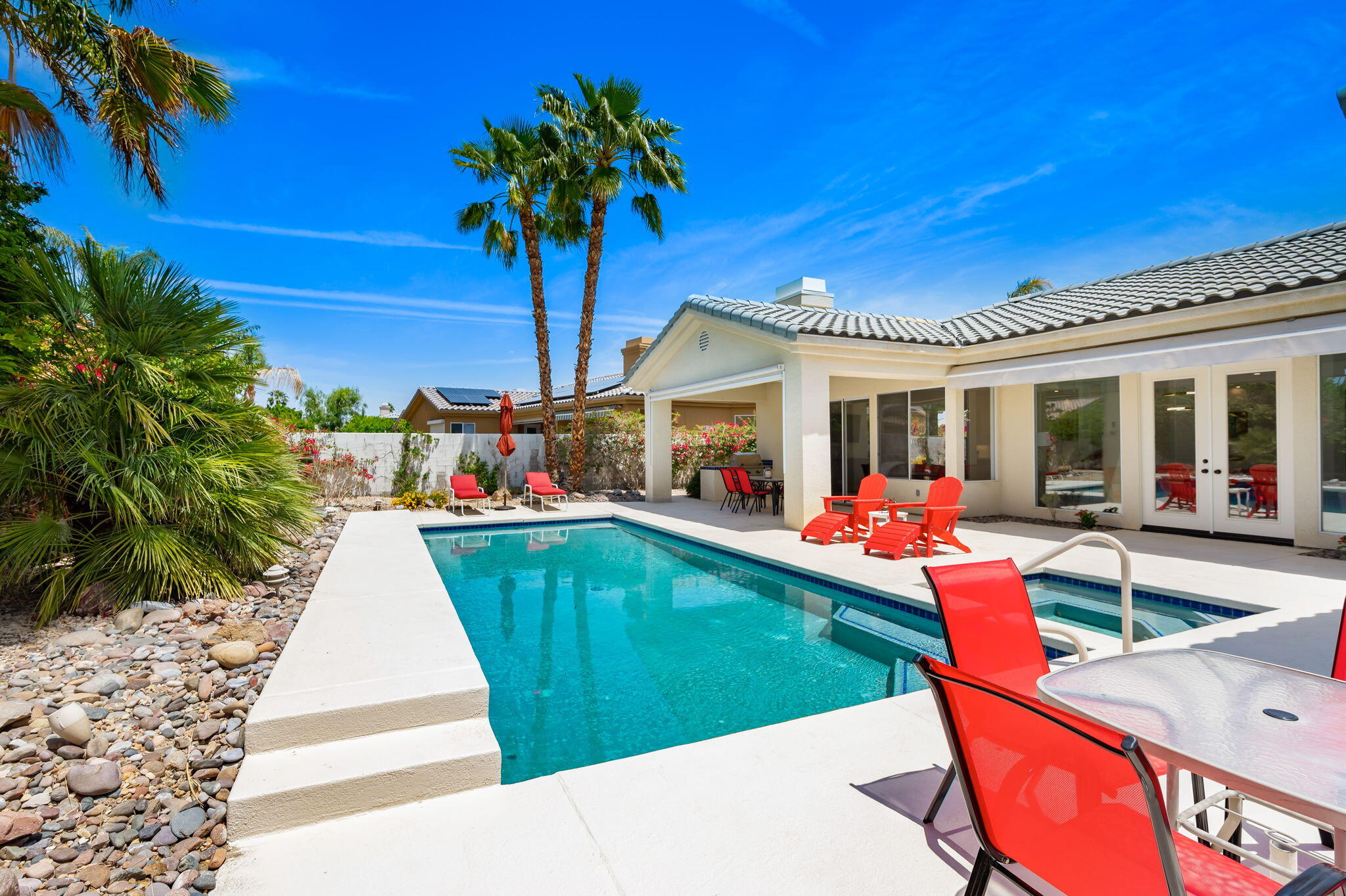 3 King Edward Court Rancho Mirage, CA 92270 - Photo 51 of 57 a view of a house with swimming pool and sitting area