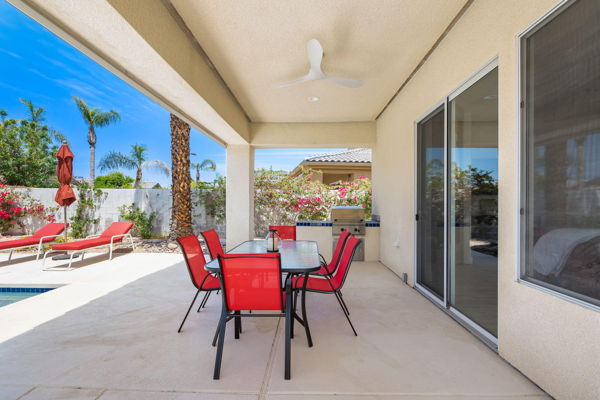 3 King Edward Court Rancho Mirage, CA 92270 - Photo 55 of 57 a dining room with furniture and a floor to ceiling window