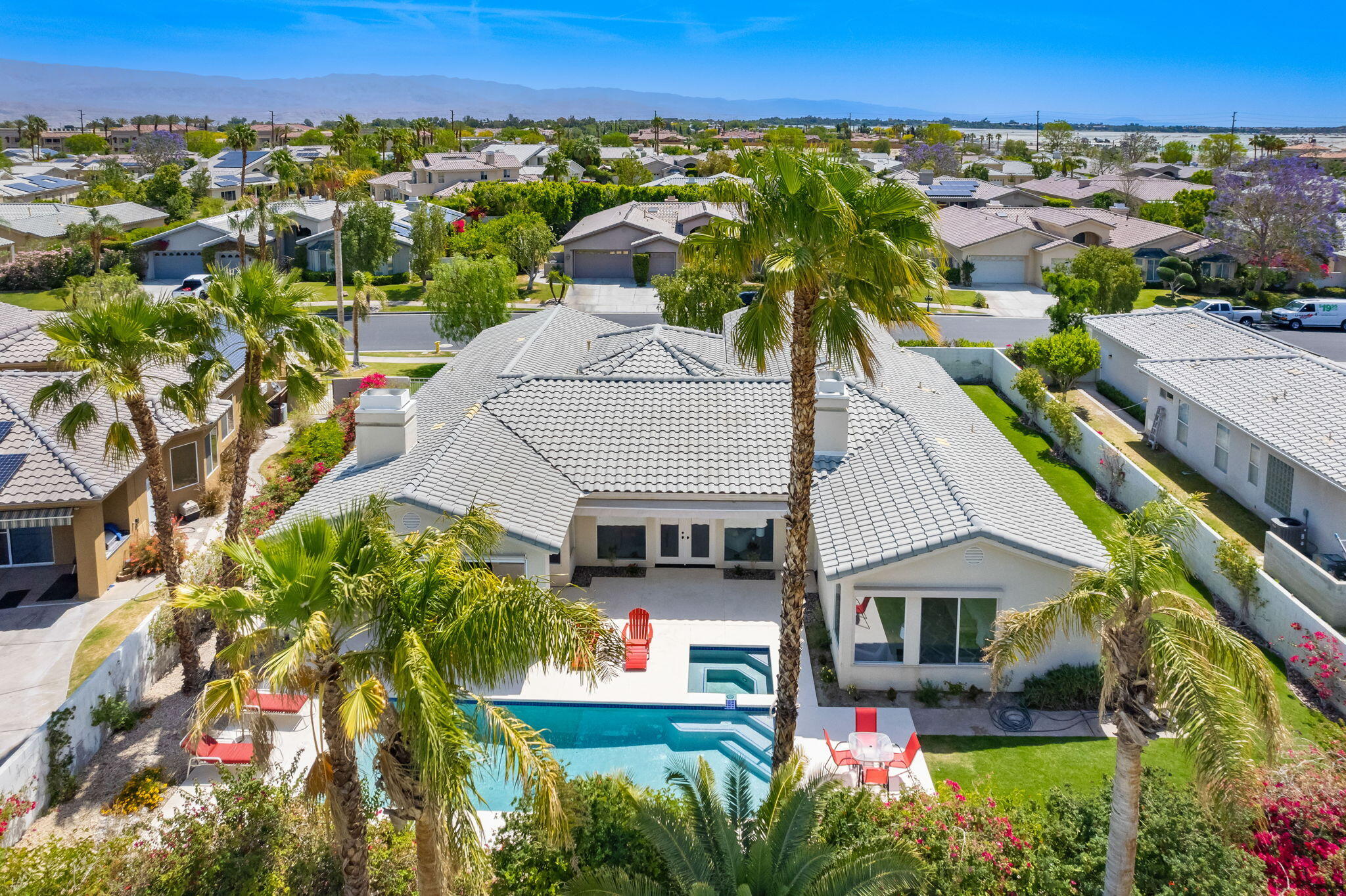 3 King Edward Court Rancho Mirage, CA 92270 - Photo 9 of 57 an aerial view of a house with a yard and lake view