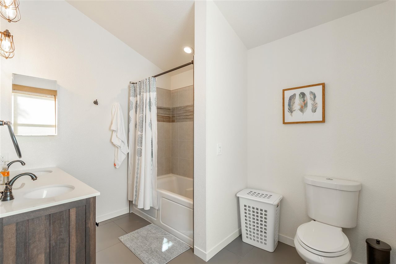 5641 Rhodesia Road Carnelian Bay, CA 96140 - Photo 15 of 21 a bathroom with a toilet sink and shower