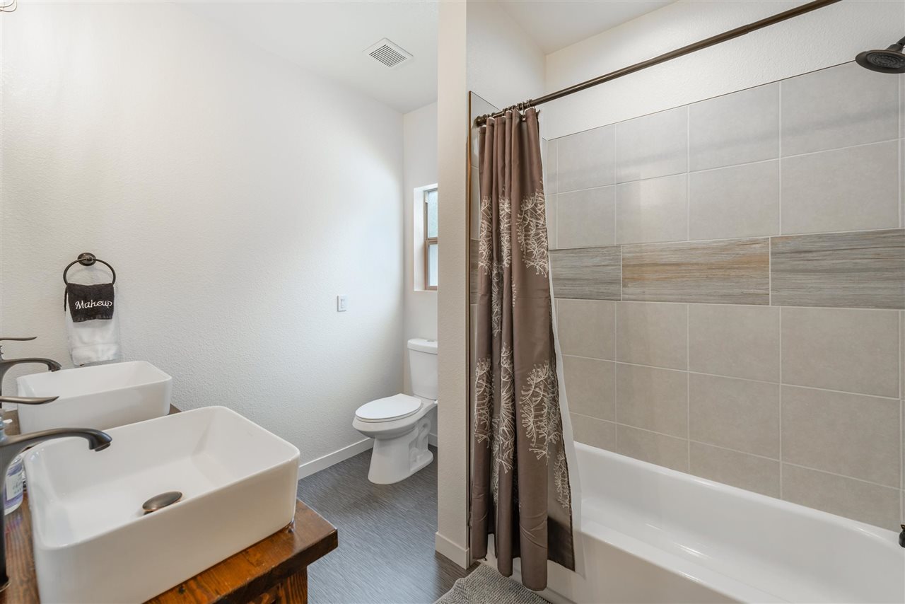 5641 Rhodesia Road Carnelian Bay, CA 96140 - Photo 19 of 21 a bathroom with a sink a toilet and shower