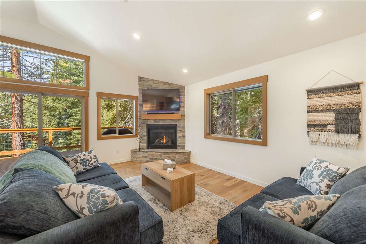 5641 Rhodesia Road Carnelian Bay, CA 96140 - Photo 5 of 21 a living room with furniture large window and a flat screen tv