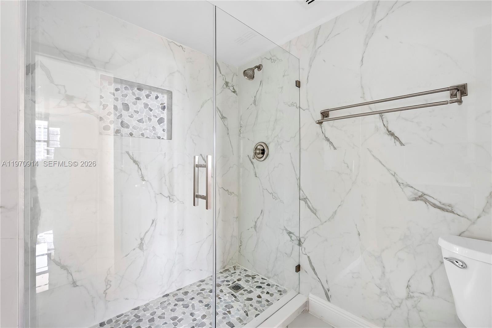 336 North Birch Road, Unit PH Fort Lauderdale, FL 33304 - Photo 26 of 68 a bathroom with a shower and a toilet