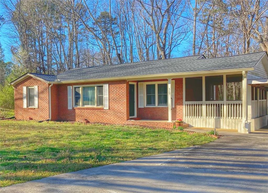317 Mulberry Rock Road Temple, GA 30179 - Photo 1 of 1 a front view of a house with a garden