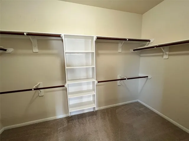 a view of an empty walk in closet
