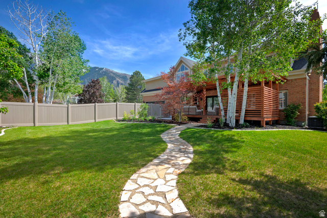 16 Gatehouse Lane Sandy, UT 84092 - Photo 52 of 73 Fenced yard with a covered deck, private yard and mountain views