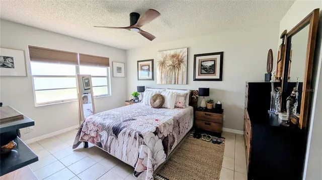 a bedroom with a bed closet and a window