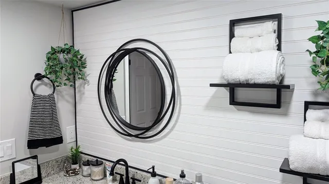 a bedroom with a bed and a dresser in it