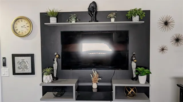 a bedroom with a bed and glass door