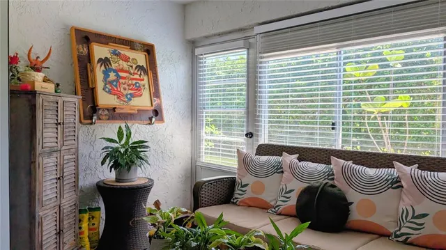 a living room with furniture and a table