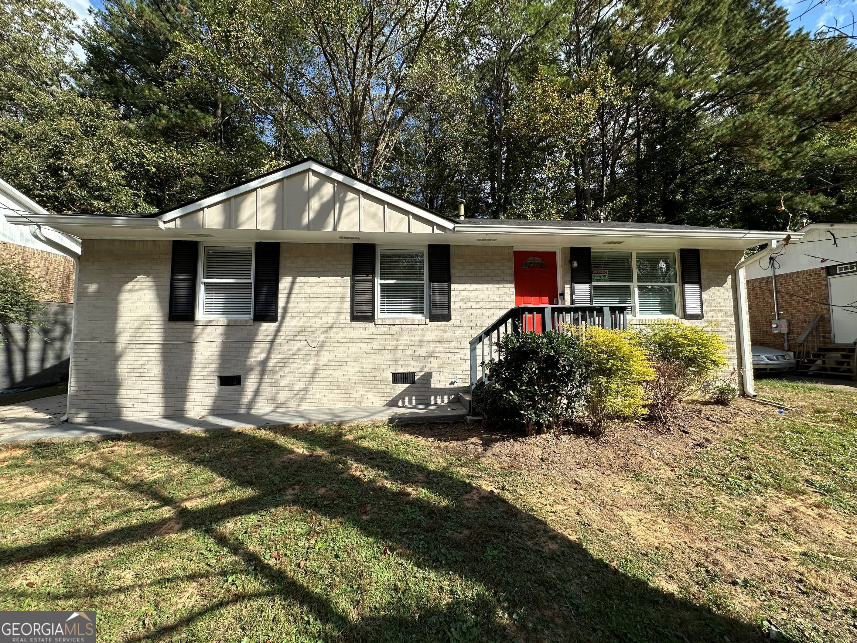 1154 Penn Court Southeast Atlanta, GA 30315 - Photo 1 of 9 a front view of house with yard outdoor seating and barbeque oven