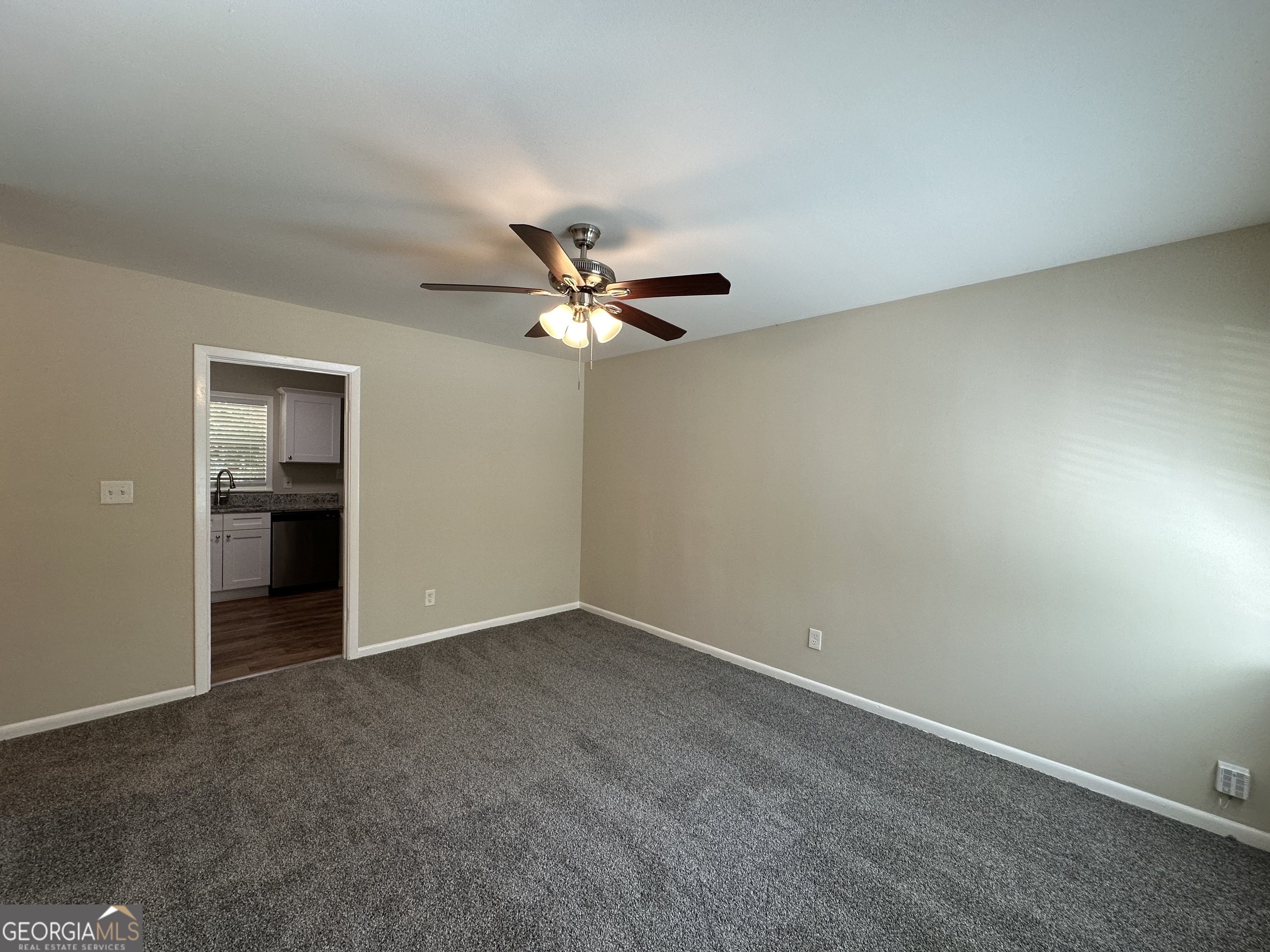 1154 Penn Court Southeast Atlanta, GA 30315 - Photo 2 of 9 a view of an empty room with a chandelier fan