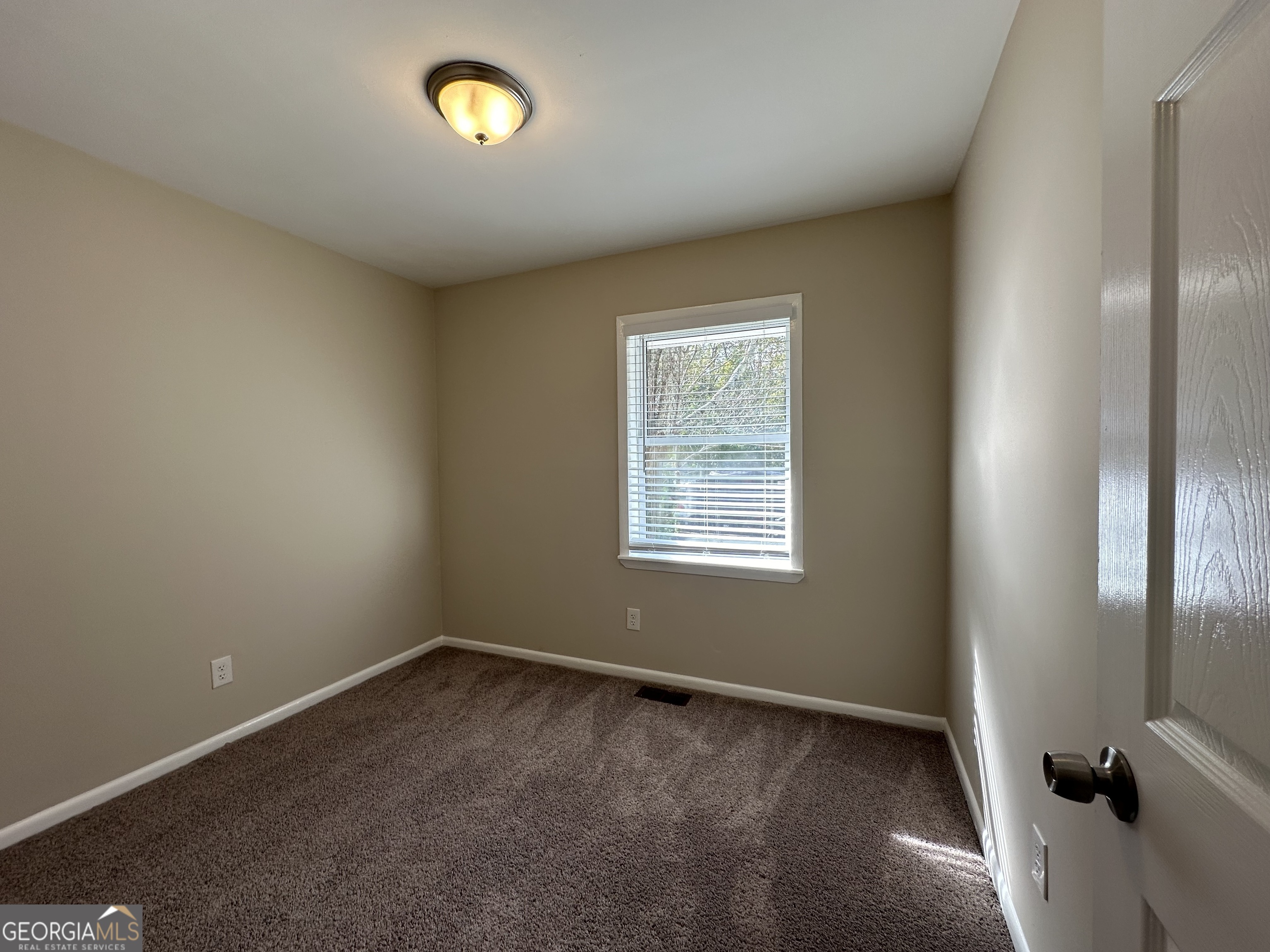 1154 Penn Court Southeast Atlanta, GA 30315 - Photo 8 of 9 an empty room with a window