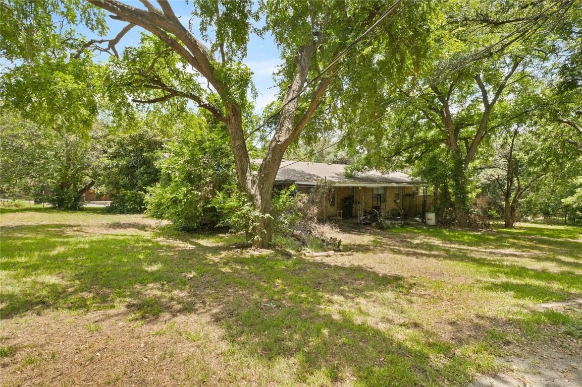 3601 Quiette Drive Austin, TX 78754 - Photo 7 of 7 View of grassy yard & wooded area on .49 acre