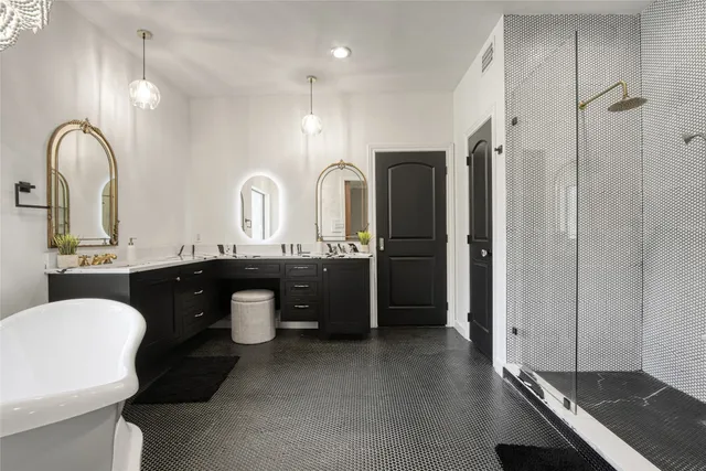 a bathroom with a double vanity sink and a mirror