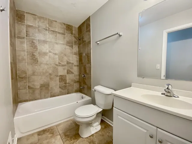 a bathroom with a sink a toilet and a bathtub