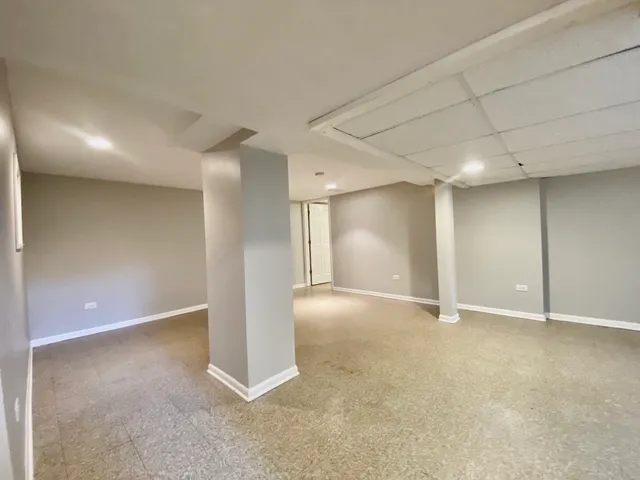 a living room with furniture and air hockey table