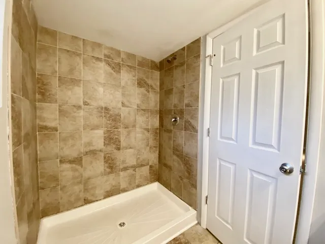 a bathroom with a toilet sink and shower