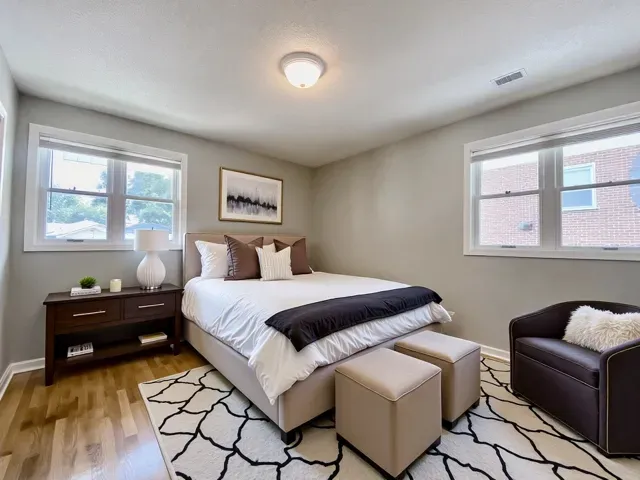 a bedroom with a bed and a couch