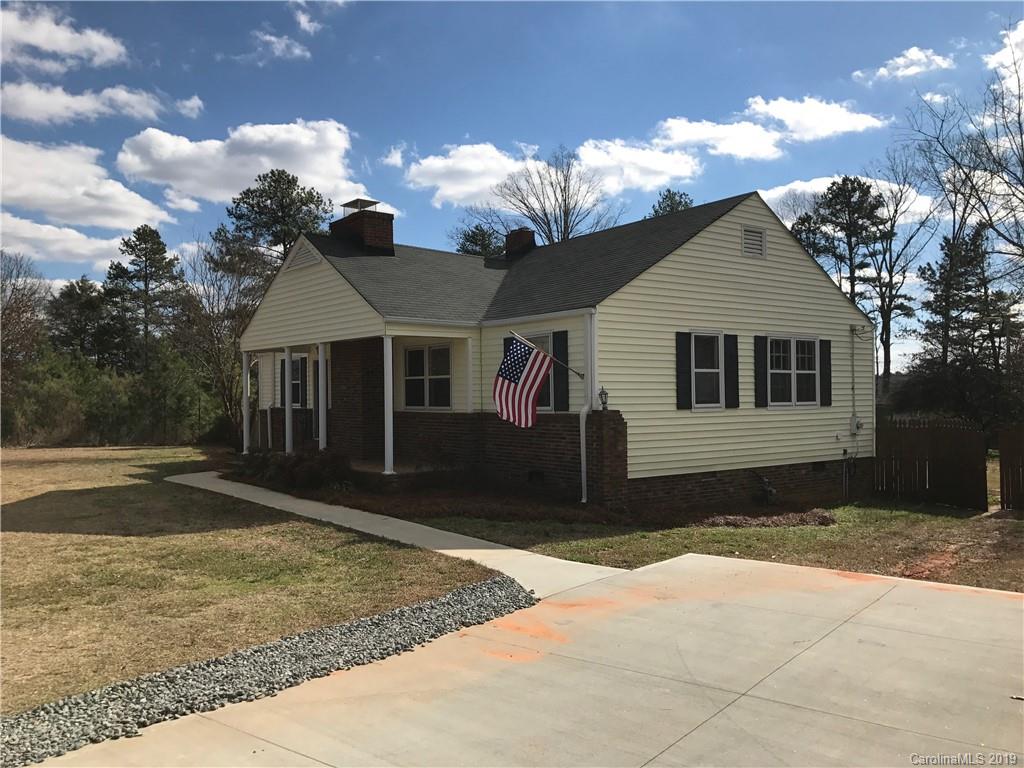 1221 Gold Hill Road Fort Mill, SC 29708 - Photo 2 of 32 a front view of a house with a yard and garage