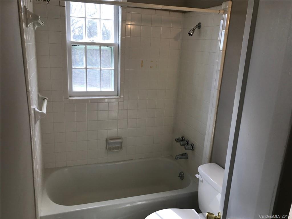 1221 Gold Hill Road Fort Mill, SC 29708 - Photo 21 of 32 a white bath tub sitting next to a toilet