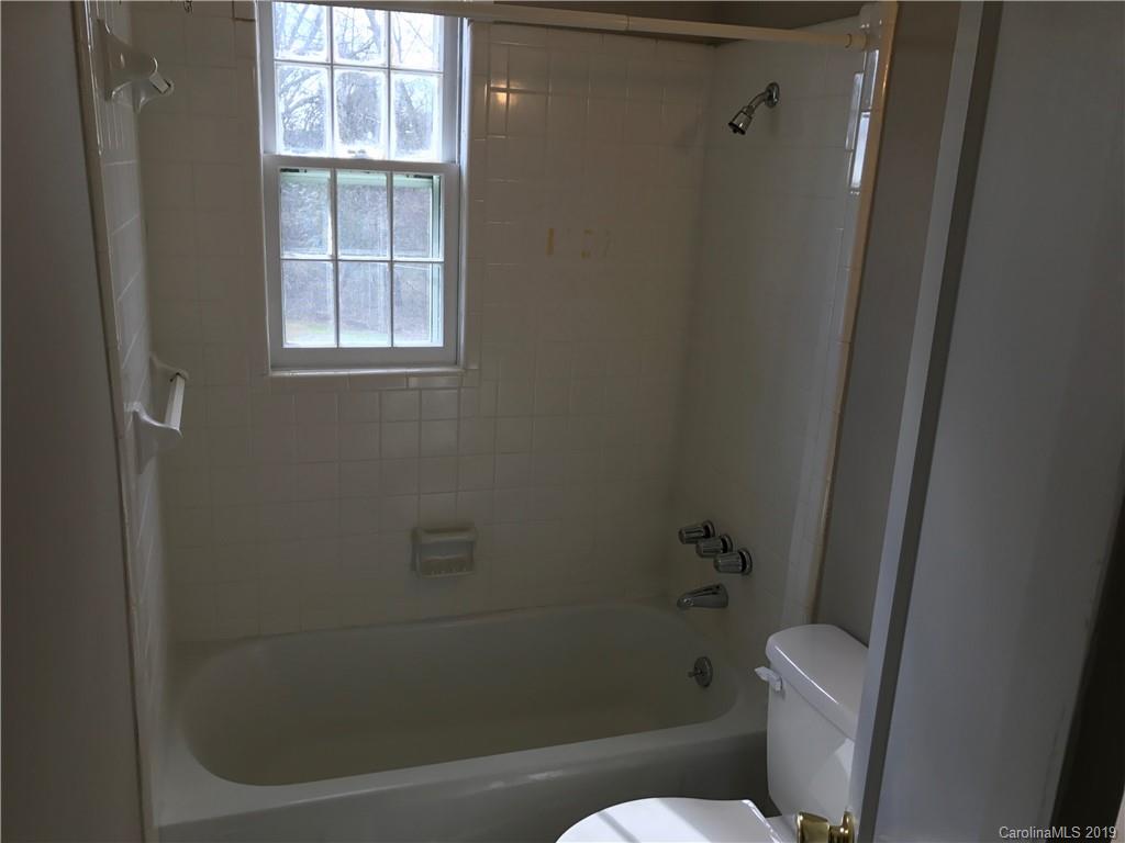 1221 Gold Hill Road Fort Mill, SC 29708 - Photo 22 of 32 a white toilet sitting next to a window