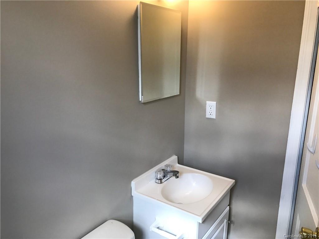 1221 Gold Hill Road Fort Mill, SC 29708 - Photo 23 of 32 a bathroom with a sink toilet and mirror